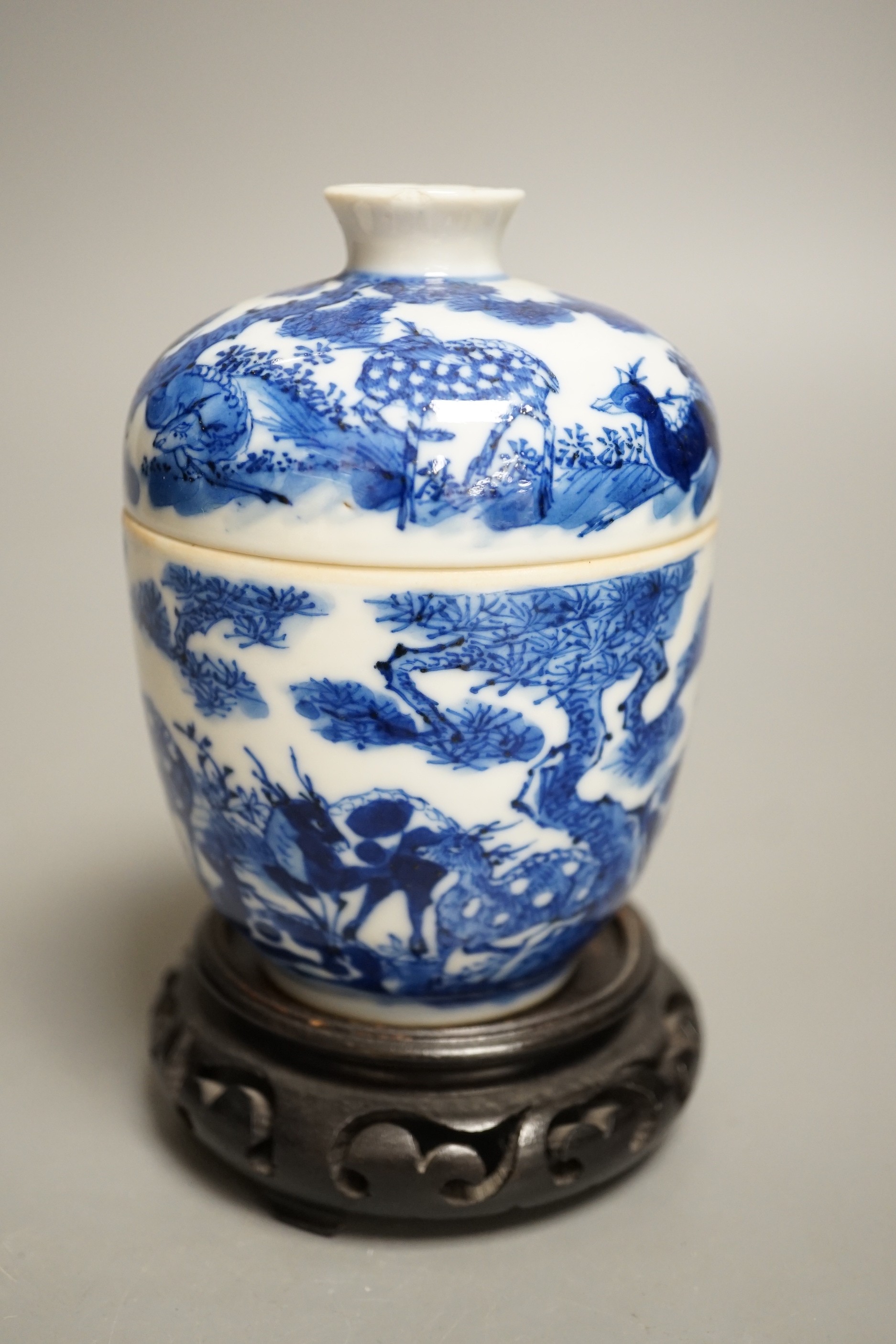 A 19th century Chinese blue and white ‘eight deer’ bowl and cover, ‘man tang fu ji’ mark, 12cm excluding wood stand